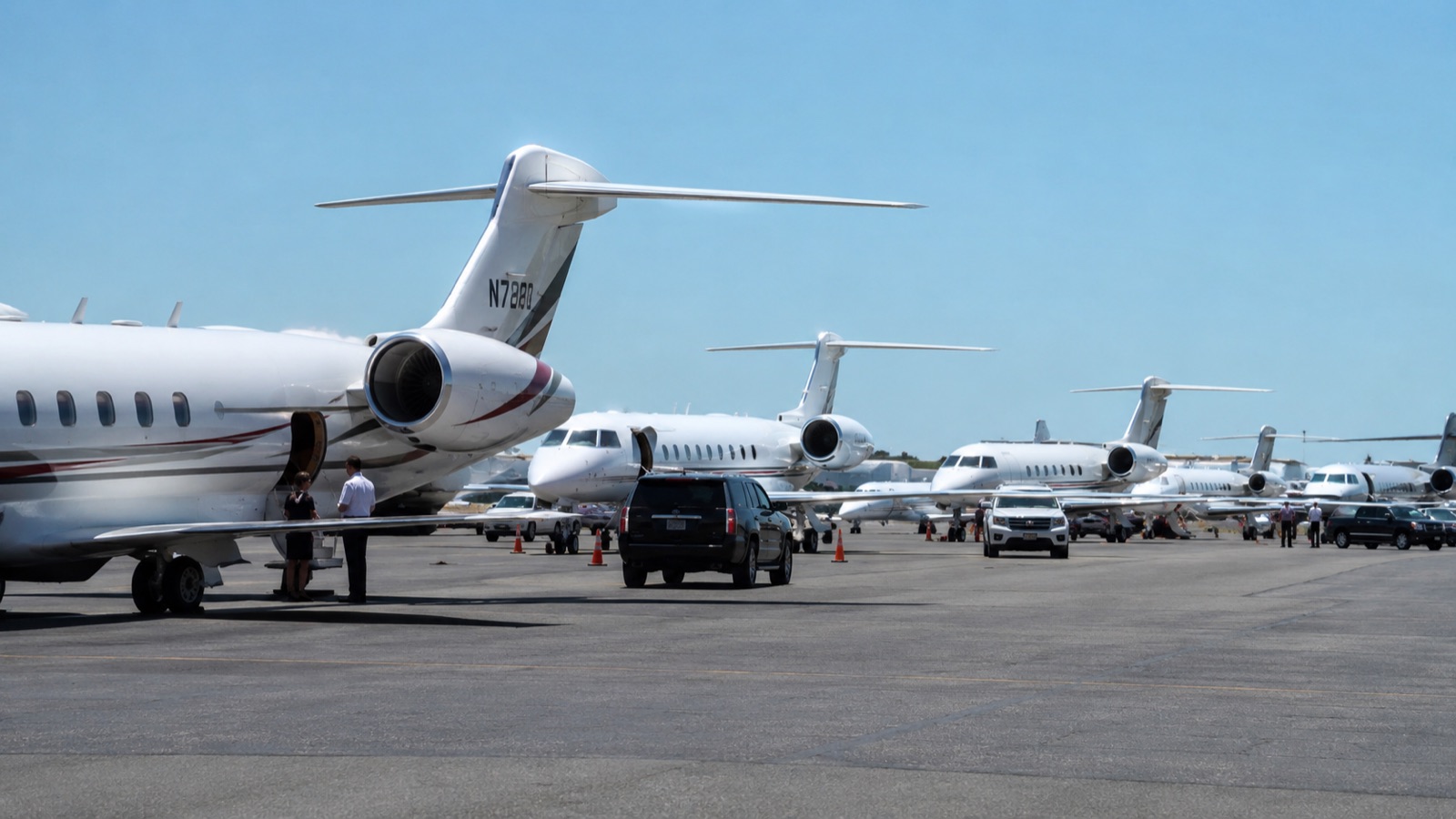 Business jets lined up at a busy US private aviation terminal during the summer peak